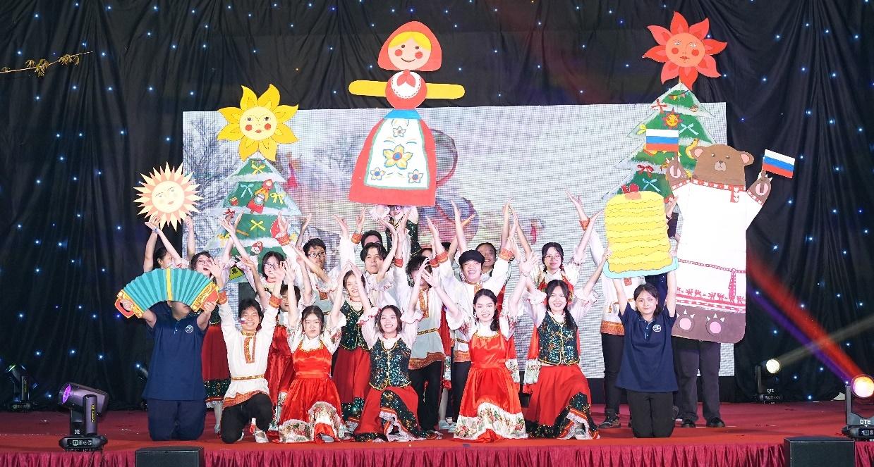 A group of children performing on stage</p>
<p>Description automatically generated with medium confidence